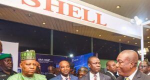 When Kashim Shettima Visited Shell Stand At 30th Nigeria Economic Summit In Abuja L-R: Vice President Kashim Shettima; Chairman, Nigerian Economic Summit Group, Mr Olaniyi Yusuf, a security detail and Shell’s Business Value Manager, Chidi Nkazi, at the exhibition booth of Shell during the ongoing Nigerian Economic Summit in Abuja…