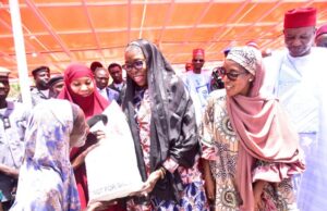 Dangote Foundation Flags Off ₦16B 2025 National Food Intervention Programme L-R: One of the beneficiaries receiving a10kg bag of Rice from, Dr. Khadija Sulaiman, Deputy Commandant Hisbah Women; Managing Director/ CEO, Aliko Dangote Foundation, Zouera Youssoufou; Executive Director Operations, Dangote Sugar Plc, Mariya Aliko Dangote, representing the Chairman/Founder, Aliko Dangote Foundation and Kano state Deputy Governor, Comrade. Aminu Abdulssalam Gwarzso,at the Aliko Dangote Foundation (ADF) Flag - Off ceremony of the 2025 National Food Intervention Programme & Distribution of Rice to 120,000 Beneficiaries in Kano state on Thursday 13 March 2025...