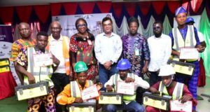 Dangote Cement Commended By Minister Over Host Community Youth Development L-R: (Back Row) Oloyede Oladipupo, Dangote Packaging, Human resources / Admin Manager; Olumuyiwa Tubi, Dangote Cement Ibese Plant, AGM/Admin; Bolanle Ajibade, Industrial Training Fund (ITF) Area Manager Abeokuta Ogun state; Roy K. Uttam, Dangote Cement Ibese Plant Director; Hon.(Dr.) Akinbode Olusola, Chairman Yewa North LGA, Ogun state; Jeremiah Ibrahim, representative of South West Coordinator of Ministry of Solid Minerals Development, Mines & Environmental Compliance and Badru Imoleayo,a beneficiary from Aga-Olowo Community and some other beneficiaries at the 2024 Skill Acquisition and Empowerment Programme ceremony of Dangote Cement Ibese Plant Ibese Ogun state…