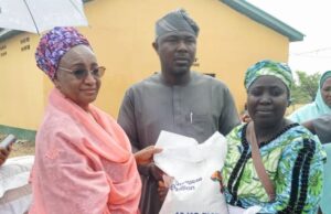 Aliko Dangote Foundation Hailed For Supporting FCT, Kogi Residents With ₦16bn Food L-R: Senior Special Adviser to the President of Dangote Group, Fatima Wali Abdurrahman, Representative of FCT Minister, Ango Abdullahi Suleiman and a beneficiary, Mary Musa, during the flagg off of the Aliko Dangote Food Intervention Programme in Abuja…Tuesday...