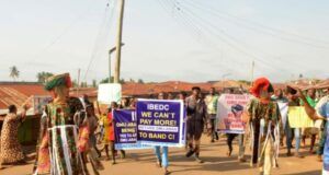 High Electricity Bills: Masquerades Lead Protest Against IBEDC IBEDC