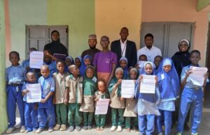 Polaris Bank Takes Financial Literacy Campaign To Warri School …a cross section of members of staff of Polaris Bank with students Damaturu during the Global Money Week recently…