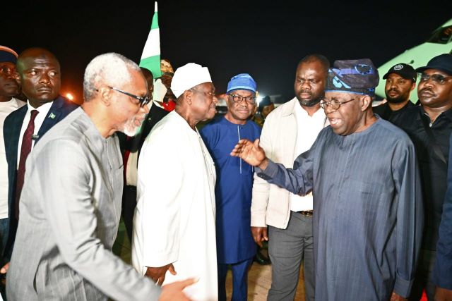 Tinubu returns ...President Bola Ahmed Tinubu, right, being welcomed back by Femi Gbajabiamila, right, and others...on Monday evening...