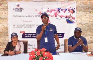 Optimal Performance: Dangote Cement Ibese Trains Host Community Leaders …Mr. Aina Olugbenga, GM HAM/Admin, Dangote Cement Plc. Ibese (standing) delivering his opening remarks while Mrs. Olalode Akiode, representative of Yewa North Local Government (left), Mr. Ademola Ojolowo, Head, Social Performance, Dangote Cement Ibese Plant (right), listen at the Capacity Building Workshop for Host Community Representatives held at Ibese, Ogun State…
