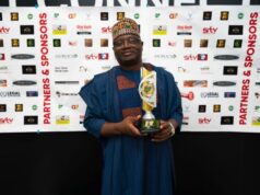 Director-General of the National Orientation Agency (NOA), Malam Lanre Issa-Onilu...with his award...
