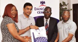 Exemplary Tax Compliance: Ogun Revenue Agency Commends Dangote Cement Mrs. Oluwaseun Olajube, Director of Field Operations OGIRS (left) and Mr. Zaka Oladele, Director of Tax Operations OGIRS (2nd right); being presented with Dangote souvenirs by the Plant Director, Mr. Ayyagari Subbaraidu (2nd left) and assisted by Mr. Emmanuel Abe, Head Finance (right)…