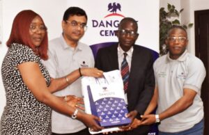 Exemplary Tax Compliance: Ogun Revenue Agency Commends Dangote Cement Mrs. Oluwaseun Olajube, Director of Field Operations OGIRS (left) and Mr. Zaka Oladele, Director of Tax Operations OGIRS (2nd right); being presented with Dangote souvenirs by the Plant Director, Mr. Ayyagari Subbaraidu (2nd left) and assisted by Mr. Emmanuel Abe, Head Finance (right)…