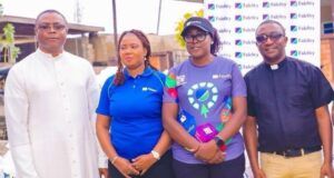 Fidelity Bank Takes Food Bank Programme To Ekiti State L-R: Church Administrator, St. Patrick Catholic Church, Ado-Ekiti, Reverend Benedict Joseph; The Branch Leader, Fidelity Bank Plc, Ado-Ekiti, Mrs. Ikeolu Akinropo; Team Lead CSR, Fidelity Bank Plc, Victoria Abuka; and Fidelity Food Bank Partner, Reverend (Dr) Michael Domingo, at the Fidelity Food Bank distribution event held in Ekiti recently…