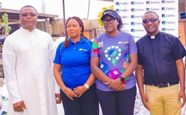 Fidelity Bank image L-R: Church Administrator, St. Patrick Catholic Church, Ado-Ekiti, Reverend Benedict Joseph; The Branch Leader, Fidelity Bank Plc, Ado-Ekiti, Mrs. Ikeolu Akinropo; Team Lead CSR, Fidelity Bank Plc, Victoria Abuka; and Fidelity Food Bank Partner, Reverend (Dr) Michael Domingo, at the Fidelity Food Bank distribution event held in Ekiti recently…