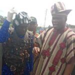 Dr Wasiu Olatubosun Oyo States Commissioner for Tourism and Culture right with one of the masqueraders
