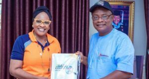 Founder Of Mahnatez International School Receives Copy Of ParrotXtra’s 20th Anniversary Compendium Hadjia Bolatito Adebisi, left, with Ambassador Olayinka Agboola...