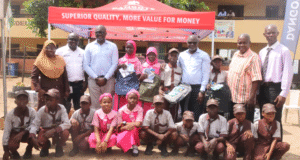 Public Schools In Lagos Receive Supply Donations From Dangote Cement From Left: Principal, Girls Junior Academy, Bello Afolake; Group Lead, Environment & Sustainability, Dangote Industries Limited, Dr. Adeyemi Adun; Group Chief, HSSE & Sustainability, Dangote Industries Limited, Dr. James Adenuga; Head of Social Performance, Dangote Cement Plc, Wakeel Olayiwola; Director (Schools Admin) representing Tutor General/ Permanent Secretary of Education District III, Bolaji Rotimi; Principal, Boys Junior Academy, Sobanke Rafiu, and Students of Girls and Boys Junior Academy, during the donation of educational materials by Dangote Cement Plc in Lagos on Thursday, October 30, 2025…