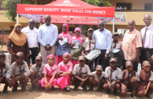 Public Schools In Lagos Receive Supply Donations From Dangote Cement From Left: Principal, Girls Junior Academy, Bello Afolake; Group Lead, Environment & Sustainability, Dangote Industries Limited, Dr. Adeyemi Adun; Group Chief, HSSE & Sustainability, Dangote Industries Limited, Dr. James Adenuga; Head of Social Performance, Dangote Cement Plc, Wakeel Olayiwola; Director (Schools Admin) representing Tutor General/ Permanent Secretary of Education District III, Bolaji Rotimi; Principal, Boys Junior Academy, Sobanke Rafiu, and Students of Girls and Boys Junior Academy, during the donation of educational materials by Dangote Cement Plc in Lagos on Thursday, October 30, 2025…