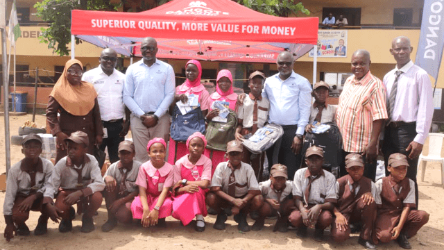 Dangote image From Left: Principal, Girls Junior Academy, Bello Afolake; Group Lead, Environment & Sustainability, Dangote Industries Limited, Dr. Adeyemi Adun; Group Chief, HSSE & Sustainability, Dangote Industries Limited, Dr. James Adenuga; Head of Social Performance, Dangote Cement Plc, Wakeel Olayiwola; Director (Schools Admin) representing Tutor General/ Permanent Secretary of Education District III, Bolaji Rotimi; Principal, Boys Junior Academy, Sobanke Rafiu, and Students of Girls and Boys Junior Academy, during the donation of educational materials by Dangote Cement Plc in Lagos on Thursday, October 30, 2025…