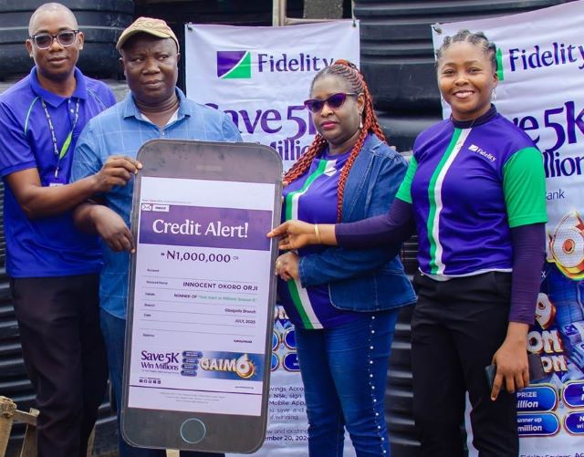 Fidelity Bank Image L–R: Direct Sales Executive, Fidelity Bank Plc, Adegboyega Ademokunwa; GAIM 6 Eight Monthly draw Winner, Innocent Okoro Orji; Branch Leader, Fidelity Bank Plc, Gbagada, Chinwe Umez-Eronini; and Product Manager, Savings, Fidelity Bank Plc, at the GAIM 6 prize presentation ceremony held at Gbagada Building Materials market in Lagos recently…