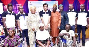 Excitement As Dangote Cement Ibese Celebrates Senior Citizens, Champions Inclusion In Host Communities Back Row, L-R, Head Social Performance, Dangote Cement Ibese Plant, Ademola Ojolowo; General Manager HAM/ Admin, Dangote Cement ibese plant, Aina Olugbemiga; Special Assistant to the Ogun State Governor on Women Affairs, Hon. Araba Adebukunola Augusta; Plant Director, Dangote cement Ibese, Ayyagari Subbaraidu; Chairman, Community Join Consultative Committee, Hon. Dayo Ogunyinka; Chairman, Yewa North Local Government, Hon. Olusola Akinbode; Head of Internal control, Dangote Cement Ibese, Sola Akinloye and Manager, HAM/Admin, Dangote Packaging Ltd, Oloyede Oladipupo with some of the beneficiaries of the Wheel Chairs. Front row, L-R, Aminat Babalola; Fausat Odu; Banji Bamidele at the Dangote Cement Ibese Plant’s 2025 Edition of A-Day Out with Senior Citizens...