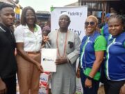 CSR: Fidelity Bank Extends Lifeline To Makoko Community In Lagos L-R: Proprietor, Part of Solution School, Makoko, Prince Shemede Taiwo; Team Lead, CSR, Fidelity Bank Plc, Victoria Abuka; Traditional Leader of Makoko Community, Shemede Emmanuel Ajaka; Head, HR Business Partnerships & Communication, Fidelity Bank Plc, Nwamaka Kalu; and Class Governor, Achievers’ Inductees Class, Fidelity Bank Plc, Oluwabusayo Obagunwa, during the Fidelity Helping Hands Program (FHHP) outreach and donation of food items and other relief materials to residents of Makoko, Lagos…