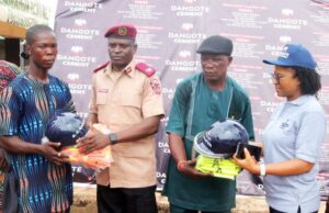 Dangote Cement Empowers Drivers, Riders, Leads Ember Month Awareness …Federal Road Safety Unit Commander Ilaro, Sulaiman Oluwadunmiye (Second left) presenting Safety kits to a beneficiary and Dangote Cement Plc, Group Head Transport /HSE, Ebere Okonkwo (right) also presents safety kits to the Chairman of the Ilaro Okada Riders Association, Comrade Adekunjo Dauda; During the Dangote Cement Plc, Ibese Plant 2025 Edition of Ember Months Road Safety Campaign in Ilaro, Ogun state…