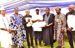 Dangote Cement Again Empowers Ibese Community, Distributes Laptops, Grinding Machines L-R, Member of Ogun State House of Assembly, Hon. Adeyanju Adegoke Awoso; HRH, Oba Lukumon Kuoye, Olu of Imasayi ; Dangote Cement Plc, Chief General Manager (Maintenance) Ibese Plant, Hemant Dave, Represent the Plant Director presenting plaptop toa benefiaciary of the Youth Empowerment Badmus Adekunle Rasaq; ; Hon Oludaisi Olusegun Elemide, Speaker Ogun state House of Assembly; Chairman of Yewa North Local Government (Ogun State) Dr. Olusola Samuel Akinbode and Group Head, Social Performance, Dangote Cement Plc, Mr. Wakeel Olayiwola at the Dangote Cement Plc, Ibese Plant, 2025 Edition of Community Day, Ibese Ogun State…
