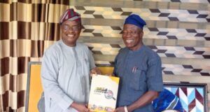 The Polytechnic Ibadan’s Ag Rector, Dr Taiwo Lasisi Receives Copy Of ParrotXtra’s 20th Anniversary Compendium Ambassador Olayinka Agboola, left, with Dr Taiwo Lasisi...
