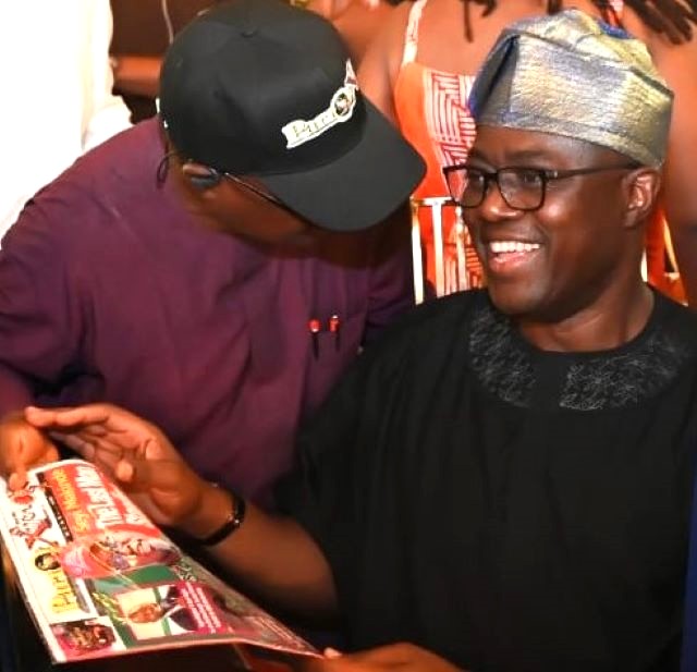 Makinde and publisher ...Oyo's Governor Seyi Makinde, holding our ParrotXtra Magazine, with our Publisher, Ambassador Olayinka Agboola, left, at Fasola, Oyo, on Thursday, December 25, 2025...