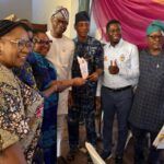 Dr Sola Akande and other elated staff members of OYSHIA at the event