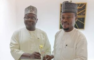 Centre For Positive Value Reorientation & Advocacy Honours NOA Mallam Lanre Issa Onilu, left, receives NOA's award...