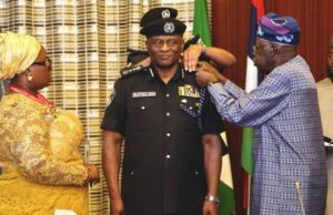High Expectations As Tinubu Decorates Tunji Disu As Acting IGP Acting IGP, Tunji Disu, being decorated by President Bola Tinubu, while the police officer's wife watches...