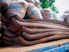 Police Reject ₦100m Bribe, Smash ₦400m Railway Vandal Syndicate Stack of rusted curved metal blades on a truck bed with burlap sacks in the background.