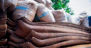 Police Reject ₦100m Bribe, Smash ₦400m Railway Vandal Syndicate Stack of rusted curved metal blades on a truck bed with burlap sacks in the background.