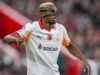 Galatasaray’s Victory Over Fenerbahçe Thrills Osimhen Soccer player in a white Galatasaray jersey with SOCAR sponsor, wearing a protective face mask during a match.
