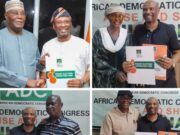 2027: Abidikugu Picks ADC Nomination Forms To Contest House Of Reps Seat For Ibadan North East/ South East Two men in traditional attire shake hands while holding an election nomination form at an ADC event.