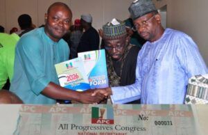 Battle For APC Gubernatorial Ticket: Barr Akeem Agbaje Picks Forms Three men shake hands at a political event, presenting a nomination form while a large APC receipt sits in the foreground.