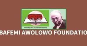 Obafemi Awolowo Foundation Opens Applications For Future Leaders Fellowship Across Africa, Diaspora Logo of Obafemi Awolowo Foundation on a brown background, featuring a green-framed image of an open book with a red brain illustration and a portrait photo of Obafemi Awolowo; text reads OBAFEMI AWOLOWO FOUNDATION.