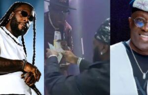 Burnaboy Showers Dollar Notes On Adewale Ayuba During Performance Collage of three men on stage: left with braids and sunglasses, center handing a trophy, right smiling man in a blue cap and glasses.