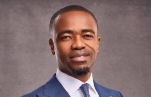 First Bank Strengthens Leadership As Julius Omodayo-Owotuga Joins Board As Executive Director Professional portrait of a man in a blue pinstripe suit, white shirt, and patterned tie, looking at the camera with a calm smile.