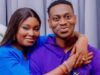 Nollywood Actor Lateef Adedimeji, Wife Welcome Triplet Sons Smiling couple hugging; woman in blue rests her arms on the man’s shoulders, both facing the camera.