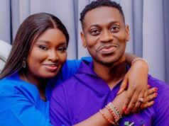 Nollywood Actor Lateef Adedimeji, Wife Welcome Triplet Sons Smiling couple hugging; woman in blue rests her arms on the man’s shoulders, both facing the camera.
