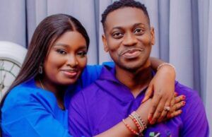 Nollywood Actor Lateef Adedimeji, Wife Welcome Triplet Sons Smiling couple hugging; woman in blue rests her arms on the man’s shoulders, both facing the camera.