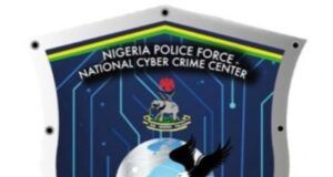 Police Arrest Mother, Daughter Over Alleged N18m Romance Scam Shield-shaped emblem of the Nigeria Police Force National Cyber Crime Center, featuring a globe, an eagle, a hacker silhouette, and circuit motifs.