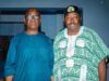 2027: Jubril Dotun Sanusi Hosts Oyo APC Guber Aspirant, Sharafadeen Alli, Discuss Tinubu’s Re-election Plan Two men standing indoors; one wears a blue traditional outfit with glasses, the other a green-and-white patterned agbada with a cap.