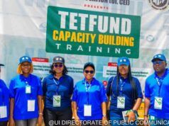 ‘Universities Judged By Research Relevance, Impact, Not Infrastructure’ Group of seven people in blue uniforms posing in front of a banner that says 'TETFUND Capacity Building Training' at a training event.