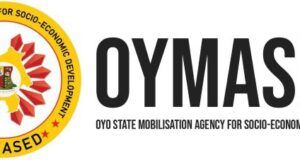 Orire School Kidnap: OYMASED Urges Public To Stay Vigilant, Report Any Suspicious Movement Logo of Oyo State Mobilisation Agency for Socio-Economic Development (OYOMASED), with a circular emblem and bold 'OYOMASED' text.