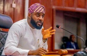 Oyo Assembly Seeks Increased Security In School Bearded man in white traditional attire and purple turban speaks into a microphone at a panel desk.