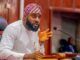 Oriire Abduction: Oyo Assembly Urges FG To Expedite Action On State Police Bearded man in white traditional attire and purple turban speaks into a microphone at a panel desk.