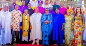Nigeria Will Overcome Current Security Challenges—Akpabio Group of dignitaries posing for a ceremony photo in colorful traditional attire on a red carpet