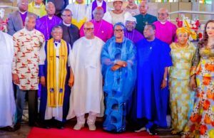 Nigeria Will Overcome Current Security Challenges—Akpabio Group of dignitaries posing for a ceremony photo in colorful traditional attire on a red carpet