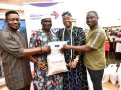 Dangote Foundation Distributes Rice To Cement Host Communities In Ogun L-R: Head of Operations, Aliko Dangote Foundation, Victor Ejiro; a beneficiary, Maria Odutola; Oba Rotimi Mulero, the Aboro of Ibeseland; a beneficiary, Adijat Ogunji and Group Head, Social Performance, Dangote Cement Plc, Wakeel Olayiwola during the distribution of 10KG Bags Of Rice to the Host Communities of Dangote Cement Plc Ibese Plant, as part of Aliko Dangote Foundation's 2026 National Food Intervention Programme…