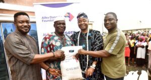 Dangote Foundation Distributes Rice To Cement Host Communities In Ogun L-R: Head of Operations, Aliko Dangote Foundation, Victor Ejiro; a beneficiary, Maria Odutola; Oba Rotimi Mulero, the Aboro of Ibeseland; a beneficiary, Adijat Ogunji and Group Head, Social Performance, Dangote Cement Plc, Wakeel Olayiwola during the distribution of 10KG Bags Of Rice to the Host Communities of Dangote Cement Plc Ibese Plant, as part of Aliko Dangote Foundation's 2026 National Food Intervention Programme…