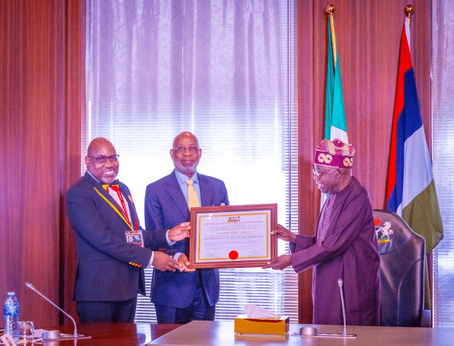 Dele Alake and Tinubu Dr Dele Alake, middle, with President Bola Tinubu, right...